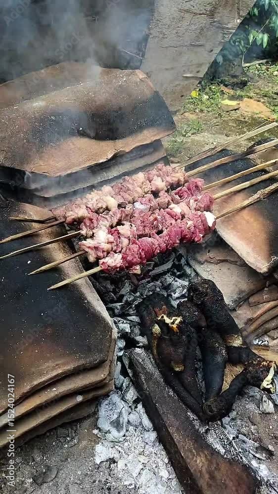 grilling delicious and tasty goat satay