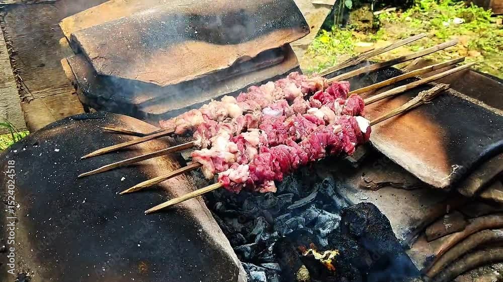 grilling delicious and tasty goat satay
