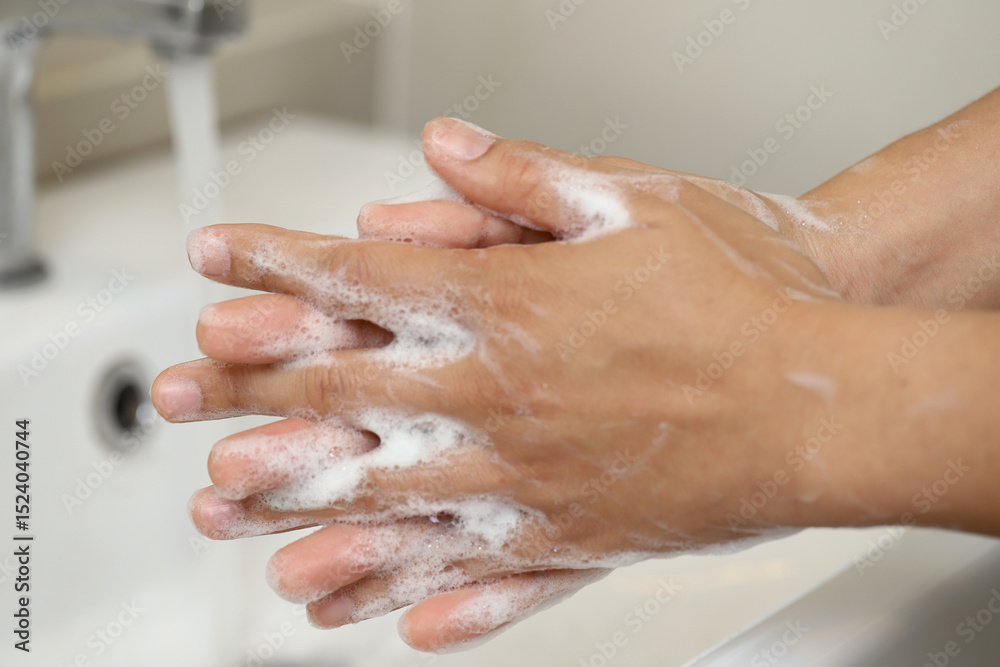 Fototapeta premium Wash your hands frequently to prevent germs