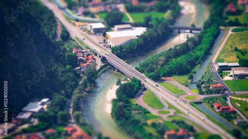 aerial view with miniature effect (tilt shift) of a road network with cars passing by