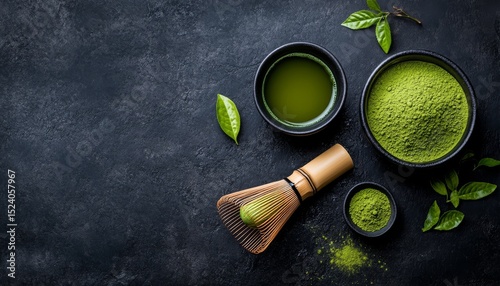 Japanese Matcha Green Tea Brewing Tradition. Green tea brewing equipment, fresh green tea leaf . matcha whisk near matcha powder in bowl on black background with Copyspace. Top view
