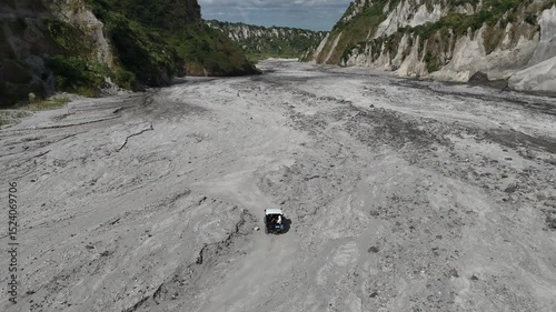 4x4 Vehicle Driving Through Lahar Trail in Mount Pinatubo, Philippines – Aerial View
