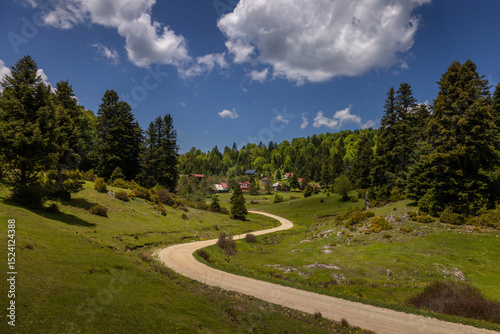 Turkey's camping plateau Sultanpinar, people having picnic and wonderful sunset in the background and the sun reflecting on the lake