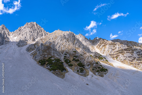 Stunning view of Seegrubenspitze peak and Hafelekar cable car station from Seegruben station on a sunny day in Spring, Innsbruck, Tyrol, Austria