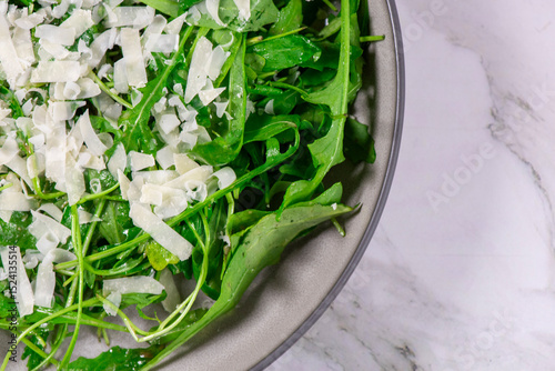 Fresh arugula salad with cheese