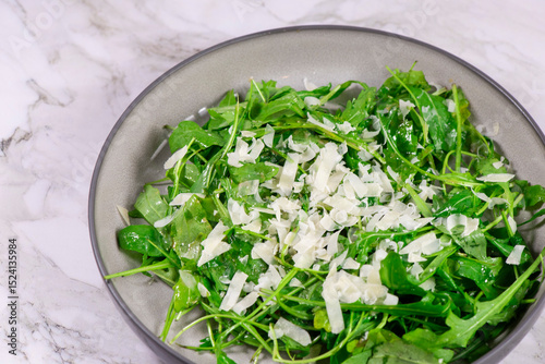 Fresh arugula salad with cheese