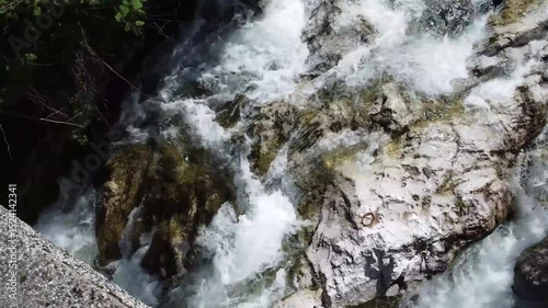 Clear Water Flowing Between Rocks