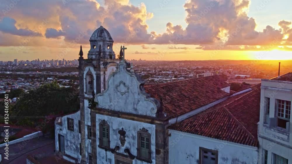 At sunset in Brazil, an aerial view of the historic architecture of Olinda in Pernambuco, Brazil with its 17th century buildings on cobblestone streets. 