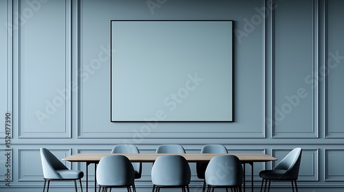 Minimalist dining room with framed artwork, wood table, and stylish seating against a blue paneled wall, creating a serene atmosphere.