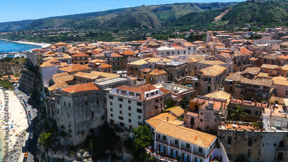 Fototapeta premium Picturesque view of Tropea, a charming town perched on a cliff overlooking the Tyrrhenian Sea in Calabria, Southern Italy