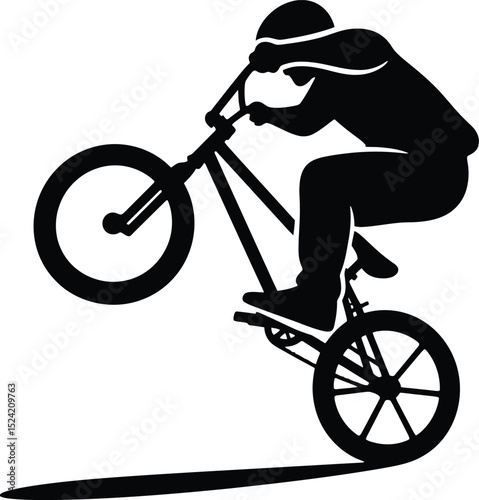 A silhouette of a cyclist performing a wheelie on a bmx bike against a white background image view