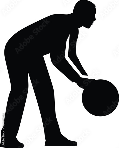 Silhouette of a person bending over to pick up a ball with their hands in a black and white image