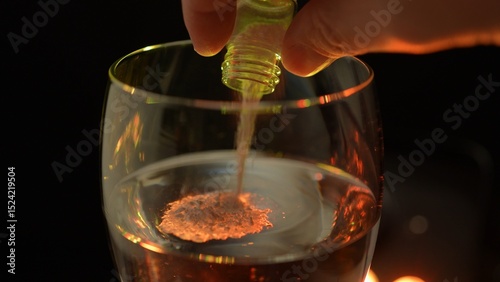 Club cocktail in the disco party get drugged. Putting drugs in drink at the bar. Strange unknown medicine powder falling down in glass with adult drink. Drink spiking.