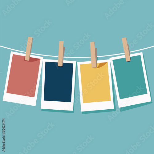 blank photos hanging on rope