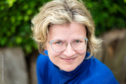 Casual portrait of a 39 yo white woman with a blue shirt, Koekelberg, Belgium