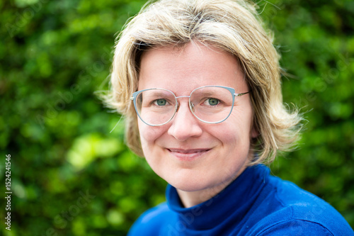 Casual portrait of a 39 yo white woman with a blue shirt, Koekelberg, Belgium