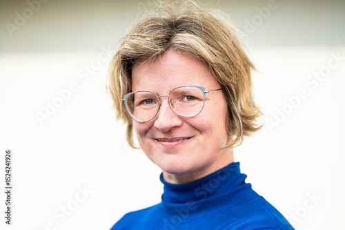 Casual portrait of a 39 yo white woman with a blue shirt, Koekelberg, Belgium