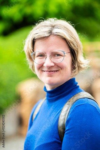 Casual portrait of a 39 yo white woman with a blue shirt, Koekelberg, Belgium