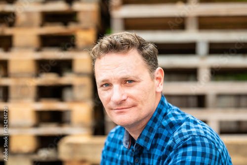 Outdoor portrait of a 46 yo white man wearing a checkered blue shirt, Koekelberg, Belgium