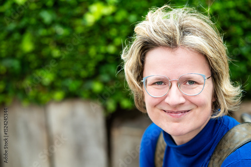 Casual portrait of a 39 yo white woman with a blue shirt, Koekelberg, Belgium