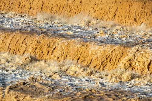 Muddy Waterfall in Flood Season with Powerful Flow