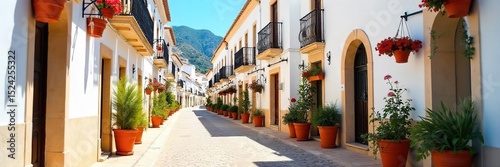 Sun-drenched whitewashed buildings, vibrant orange flower pots, and a picturesque Andalusian street scene A classic image of southern Spain's beauty and charm , culture, cobblestone, Spain