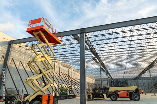 Industrial warehouse construction site. Assembling of metal and concrete frame of new logistics center in North Port, Florida