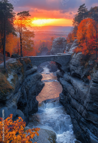 View of a stone bridge connecting two rocks on an autumn day.
