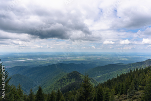 top view from mountain ladder landscape with clouds in summer carpathians romania with lights below clouds and green forests