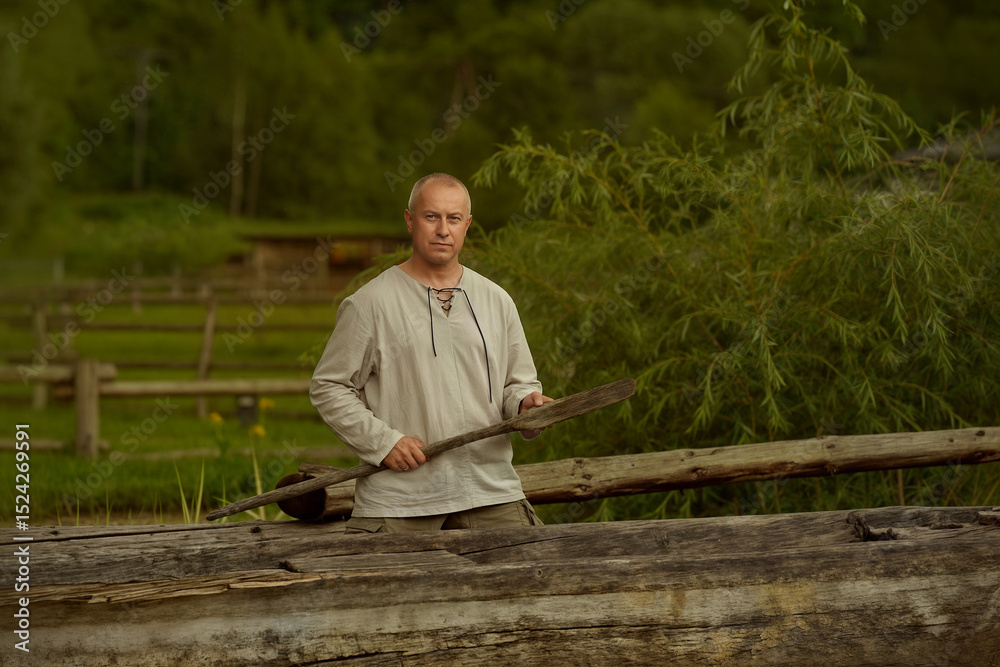 Fototapeta premium man sitting on a log