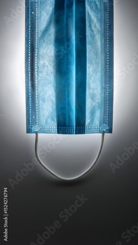 Blue Surgical Mask with Intricate Pattern on Light Background