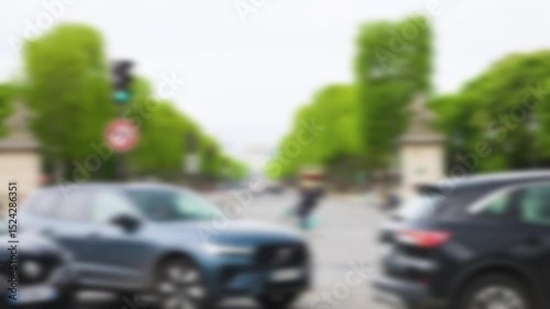 View from Place de la Concorde to the the Avenue des Champs-Elysees (Champs Elysees) avenue and the Arc de Triomphe in the distance in the 8th arrondissement. Out of focus. Paris, France.