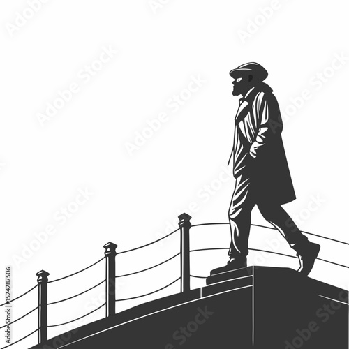 Man in coat walking along a high wall