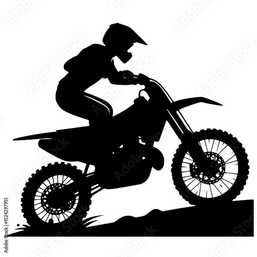 Silhouette of motocross rider on dirt bike