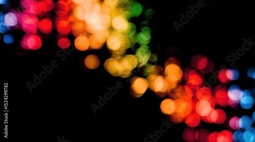 Diagonal composition of rainbow blurred lights on black background
