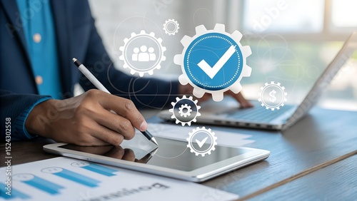  a professional engaged in a modern business process, meticulously utilizing a laptop and tablet.