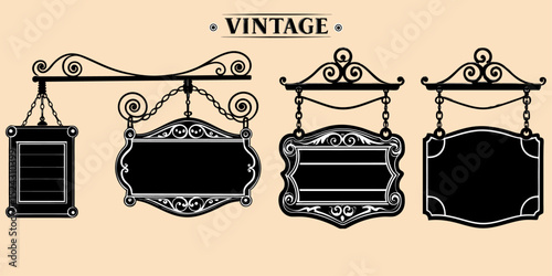 Empty double-panel black and white wood sign hanging from wrought iron bracket, old-world charm