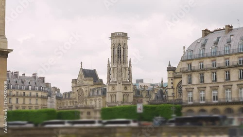 View of The Church of Saint-Germain l'Auxerrois across the Quai Francois Mitterrand in the 1st arrondissement on a cloudy spring day. Out of focus. Paris, France.
