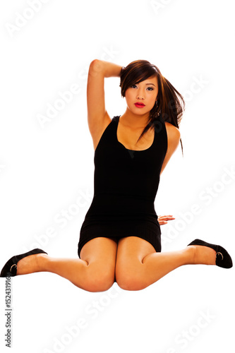 Young Attractive Asian American Woman Sitting In Dress