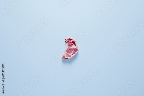 Raw steak isolated on blue background