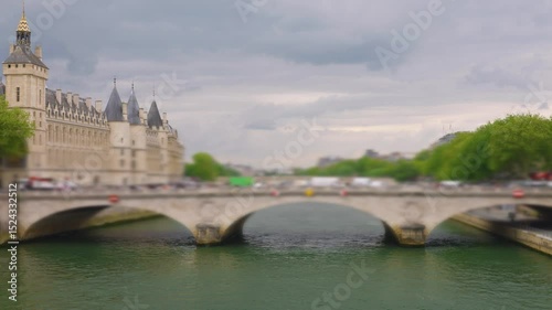View of the bridge Pont au Change over the Seine River, island Ile de la Cit and the Conciergerie in 1st arrondissement, Paris, France. Out of focus.