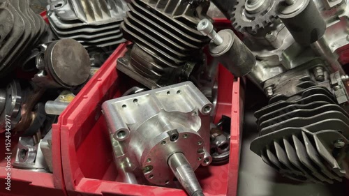 Internal combustion engine parts, cylinders, pistons, cylinder heads are on the shelves in the repair shop