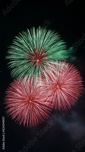 Crimson and emerald fireworks bloom like celestial chrysanthemums, echoing Bonfire Night's luminous splendor and Diwali's vibrant jubilation