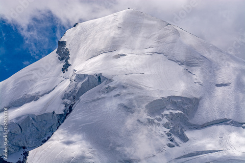 Fee Glacier with Allalinhorn – an extraordinary and unique panorama of the Allalinhorn shrouded in clouds, rising to 4027 meters