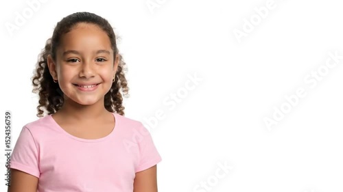 Cheerful girl smiling while standing against a plain background  