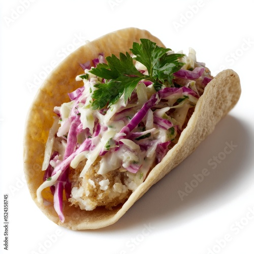 Crispy fish taco crowned with vibrant slaw, perfect for Taco Tuesday celebrations or pescatarian delights, invoking coastal fiestas
