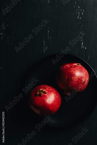 Pomegranates on a dark background.
