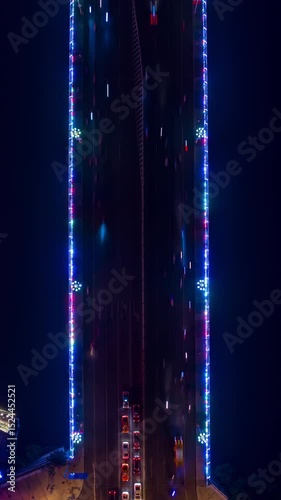 night time illumination sanya city river traffic bridge aerial vertical topdown panorama timelapse 4k china
