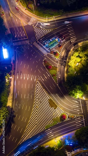 night time illuminated sanya city traffic street crossroad aerial vertical topdown panorama timelapse 4k china