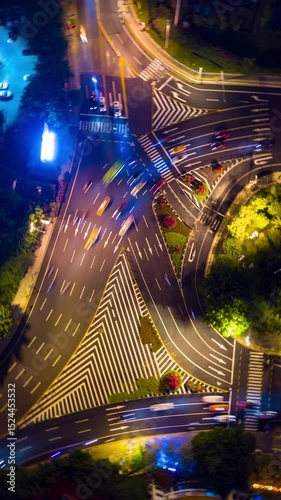 night time illumination sanya city traffic street crossroad aerial vertical topdown panorama timelapse 4k china